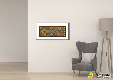 Folk art Madhubani painting with fish design hung on a living room wall