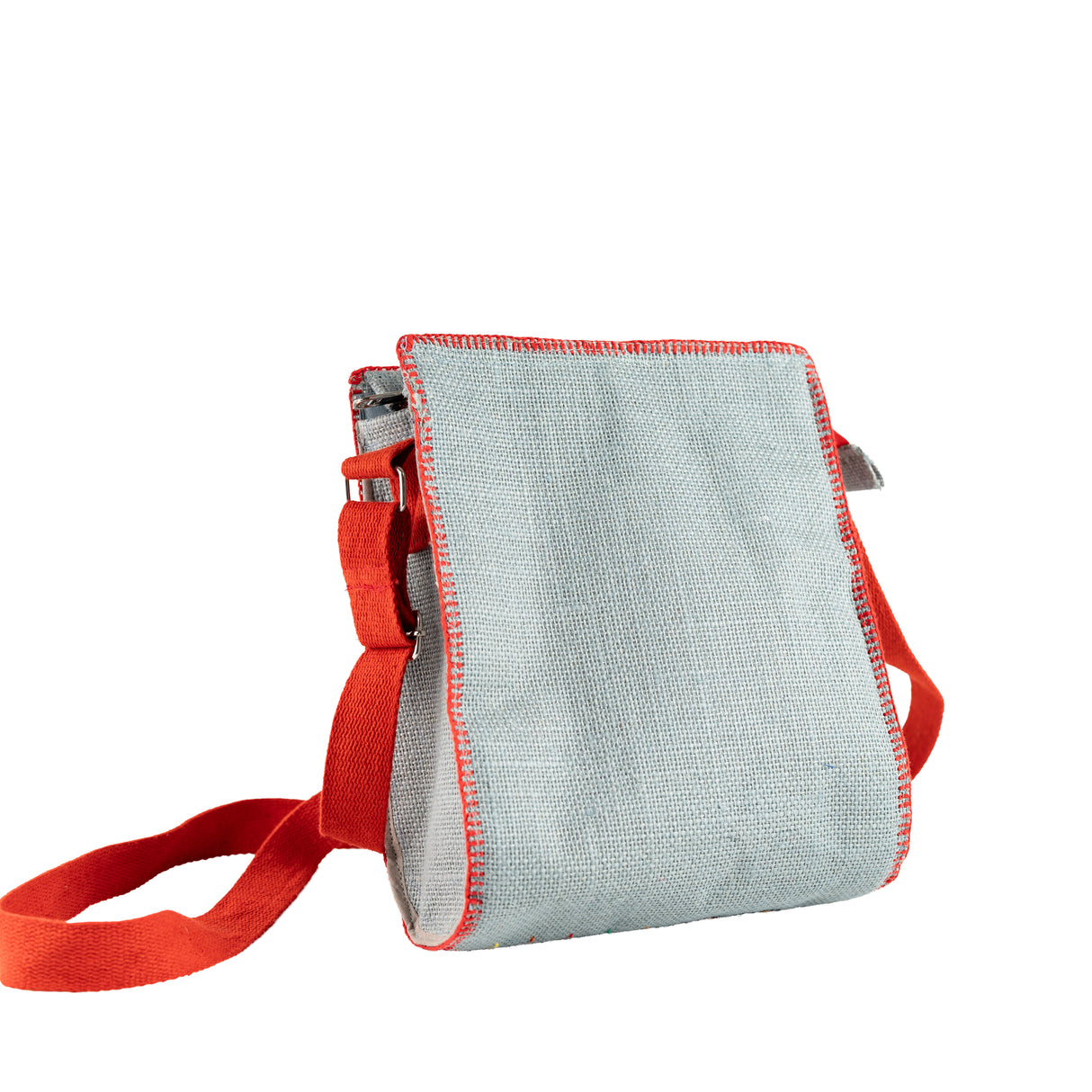 Back side of a hand embroidered jute sling bag in Grey with red belt