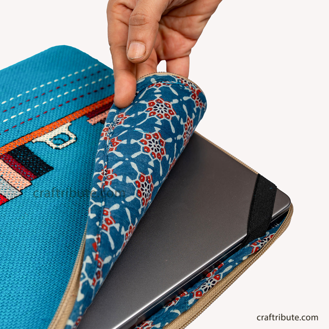 Inside view of hand embroidered jute  15" laptop sleeve showcasing the soft padding and elastic corners for extra protection of your laptoplaptop