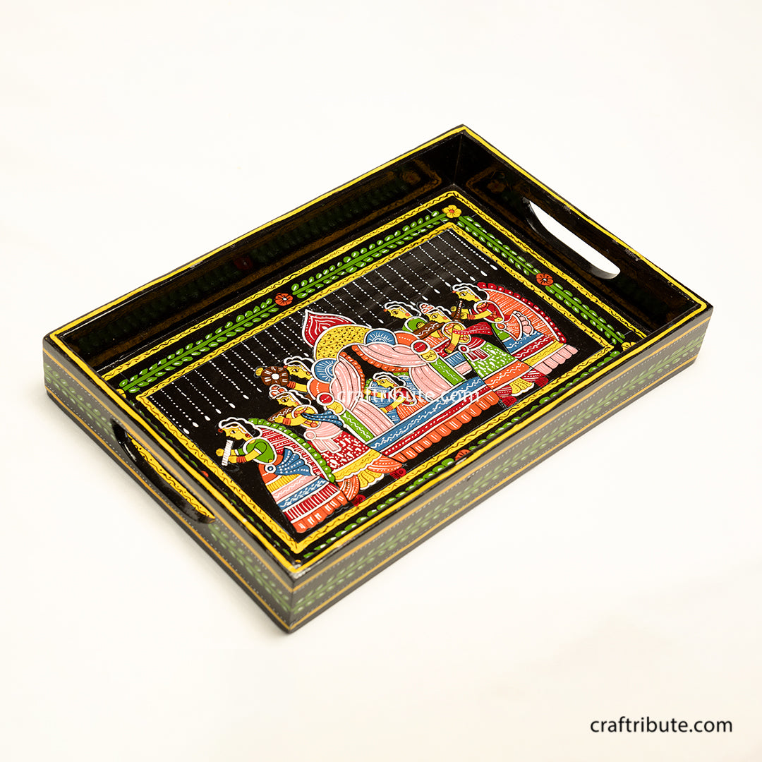 Hand-painted decorative black tray with artistic design on a white background. A beautiful example of traditional Tikuli Art from Patna, Bihar.