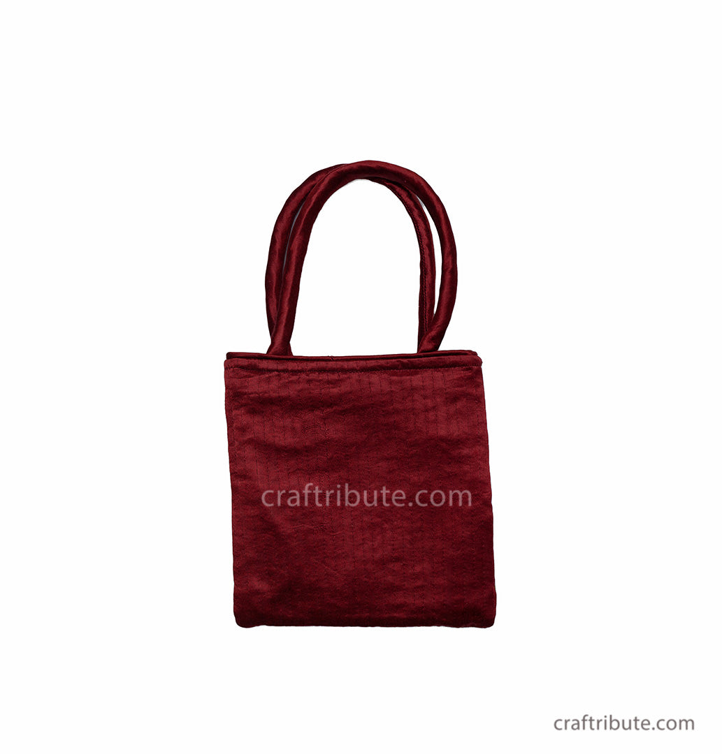 Back side of Red & Grey floral design bag hand embroidered in Kutch Pakko style