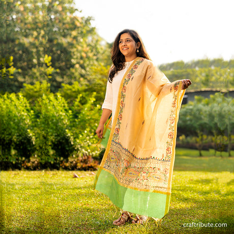 Handpainted Madhubani dupatta with green border and elaborate peacocks design