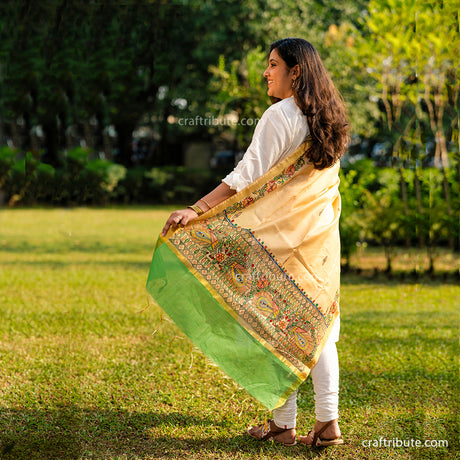 Back view of hand painted Madhubani cotton silk dupatta with green border and intricate peacocks design.