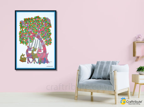 Tribal Gond Painting potraying Deer under a tree hund on the living room wall