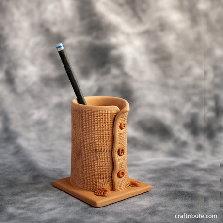Unique and sustainable stationery product - Handcrafted Terracotta Pen Stand in shape of a buttoned up coat.