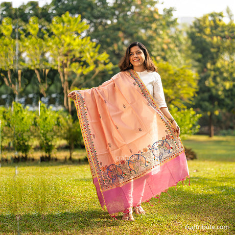 Hand painted Madhubani dupatta with elaborate fish motifs and intricate bud design all over the dupatta.