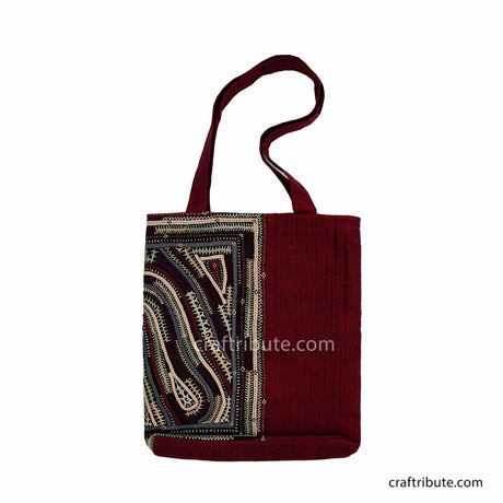 Back side of red tote bag with Khudi Seba Kutch Embroidery with grey & white design