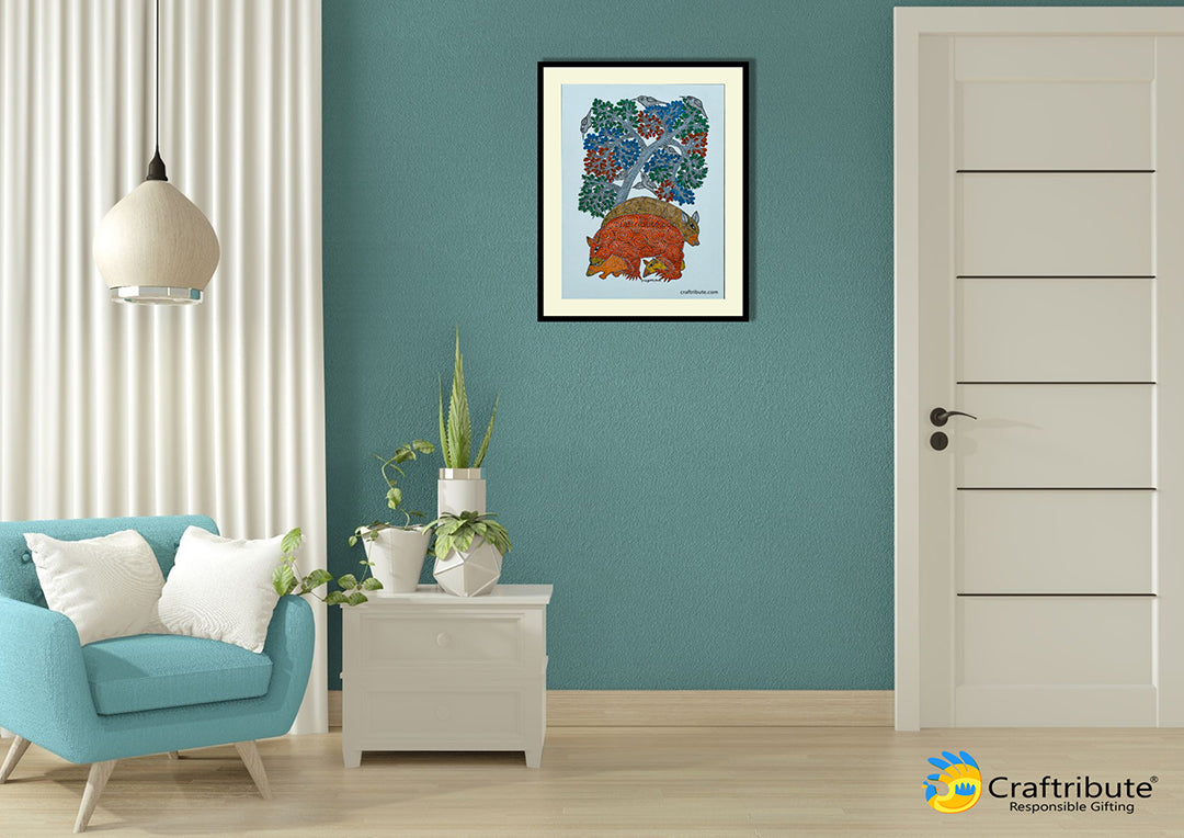 Gond Painting framed on a wall depicting bears under a tree