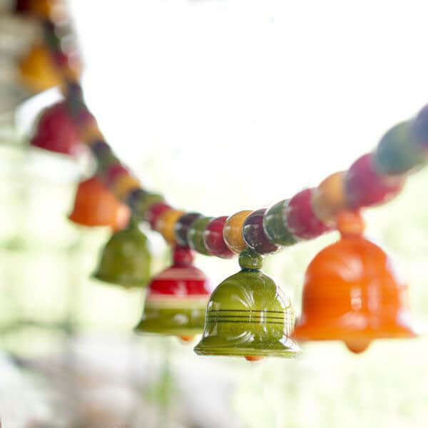 Handcrafted wooden toran with beads and bells - housewarming gift