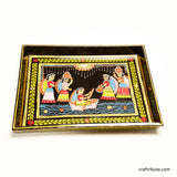 Close up of Tikuli Art hand-painted tray from Patna, Bihar, depicting a joyful riverside scene