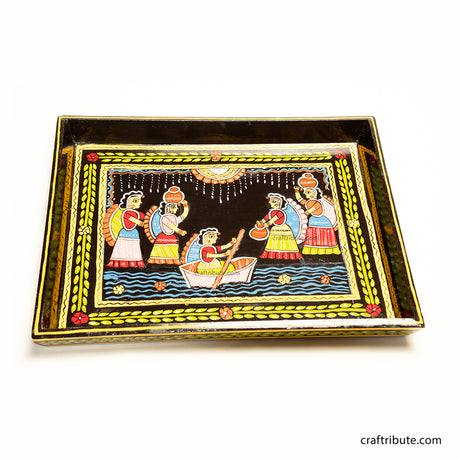 Close up of Tikuli Art hand-painted tray from Patna, Bihar, depicting a joyful riverside scene