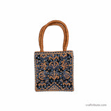 Floral design hand embroidered bag in Kutch Pakko Embroidery style