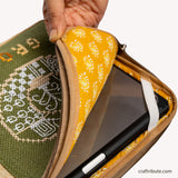 Hand Embroidered iPad/ Tablet sleeve in olive green and beige showcasing the soft padding inside with attractive patterns