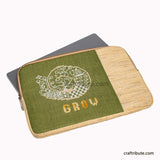 Hand Embroidered 15" Laptop sleeve in olive green and beige colours with a MacBook inside and an inspiring design 'Grow"