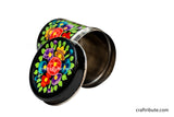 Artistic view of a hand painted steel container in black colour with floral design in bright colours