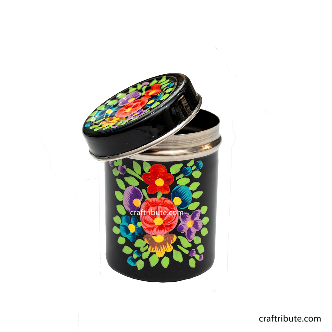 Bright floral design hand painted on a black steel container by Naqashi artisans from Kashmir