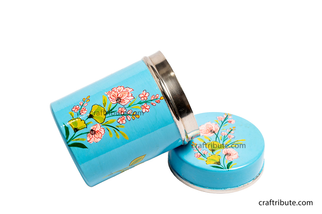 Side view of Naqashi hand painted steel container in sky blue with delicate floral design