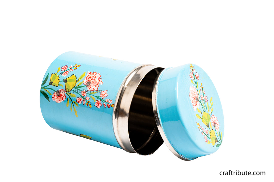 Artistic photo of Naqashi hand painted steel container in sky blue with delicate floral design