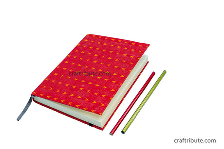 Handmade paper notebook with attractive red fabric cover and ruled pages