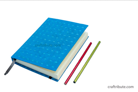 Handmade Paper Notebook by Craftribute with bright blue fabric cover with ruled pages