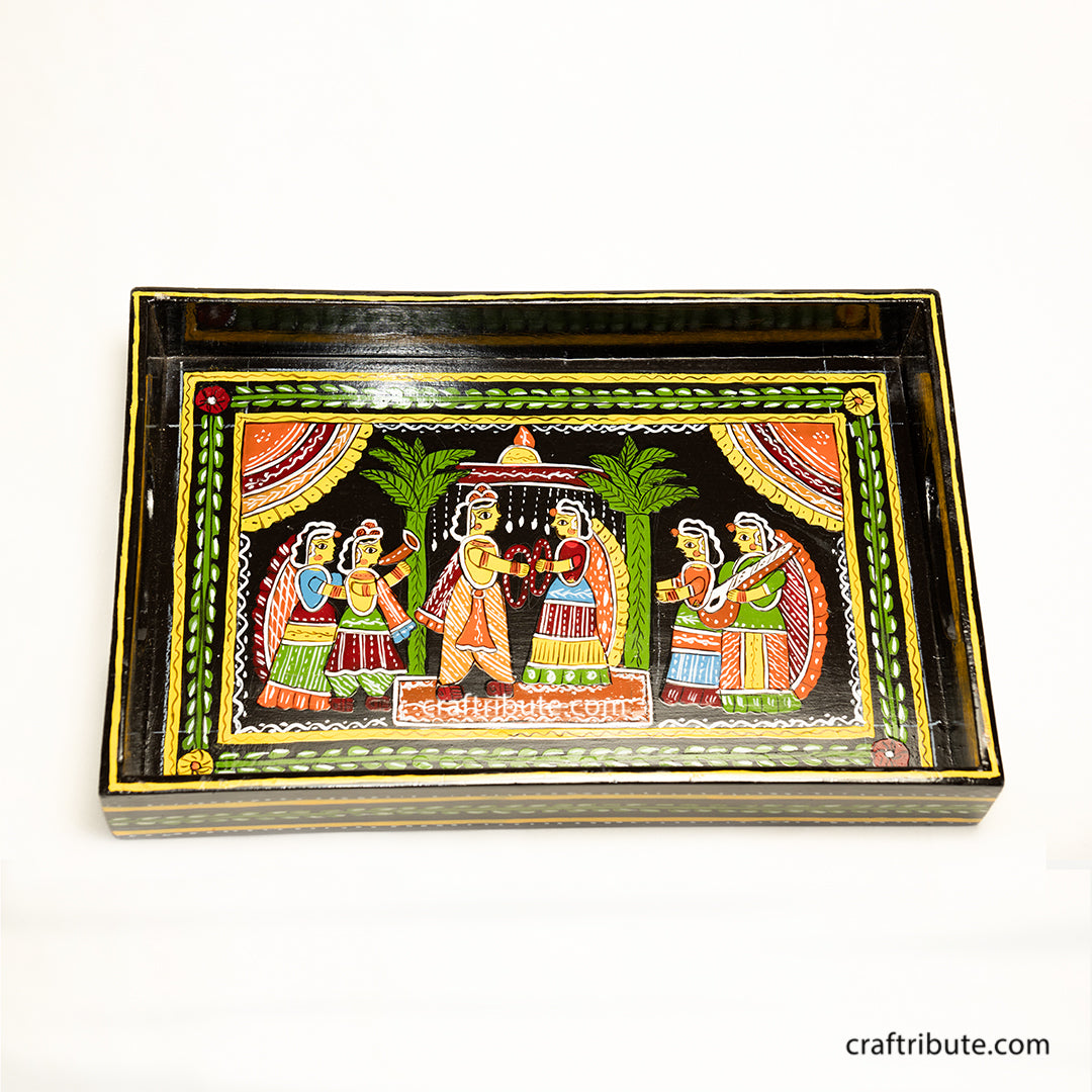Tikuli Art hand painted wooden tray depicting an indian wedding in its full grandeur. Painted in attractive colours  on a black surface