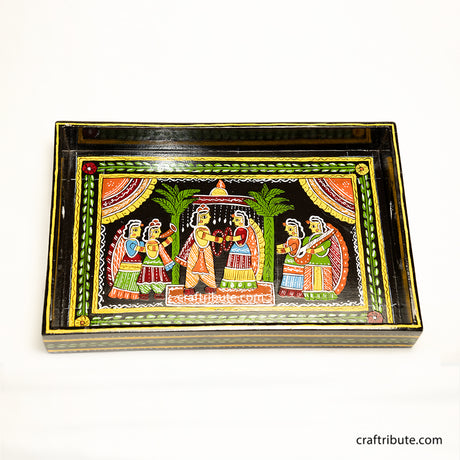 Tikuli Art hand painted wooden tray depicting an indian wedding in its full grandeur. Painted in attractive colours  on a black surface