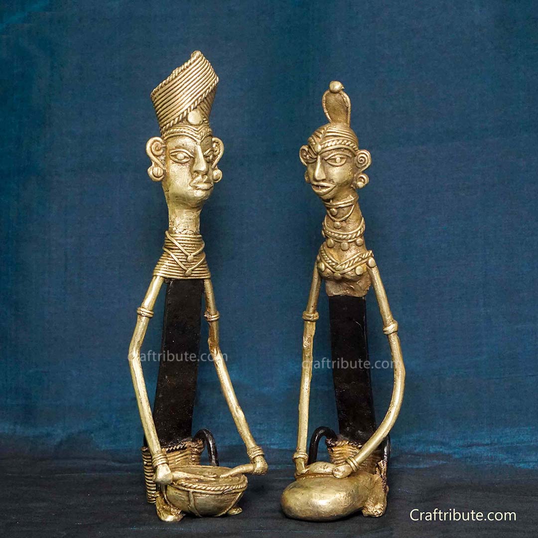 Dhokra Figurines – Tribal Couple 2- Man playing musical instrument, lady engaged in household chores