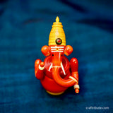 Handcrafted laquer finished Wooden Ganesha idol in organic Red colour from Etikoppaka
