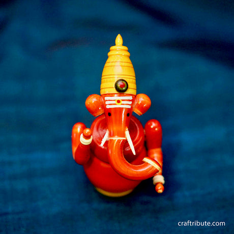 Handcrafted laquer finished Wooden Ganesha idol in organic Red colour from Etikoppaka