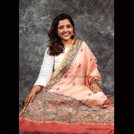 Beautiful duel tone cotton silk dupatta with red border. Hand painted in traditional Madhubani painting by talented grass root artisans from Mithilanchal, Bihar. A must have for any wardrobe as well as attractive gifting option for sister, mother, friends or colleagues