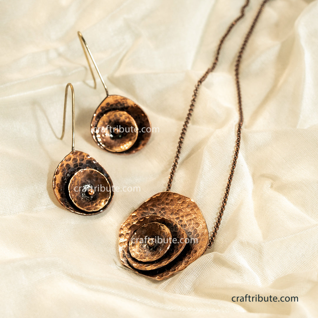 Hand Hammered Copper Earrings and Pendant inspired from beauty of a rose flower on a cream silk backdrop