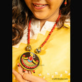 Close up of Tikuli Art Jewellery set with hand painted wooden Pendant and matching earrings