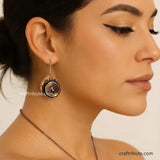 A model wearing Hand Hammered Copper Earrings inspired from beauty of a rose flower