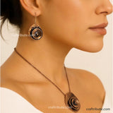 A model wearing hand-hammered copper earrings and Pendant inspired from beauty of a rose flower