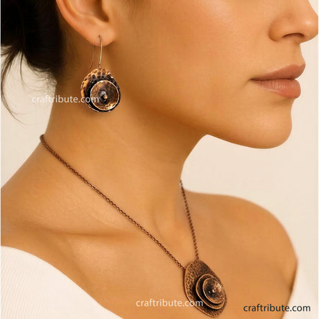 A model wearing hand-hammered copper earrings and Pendant inspired from beauty of a rose flower