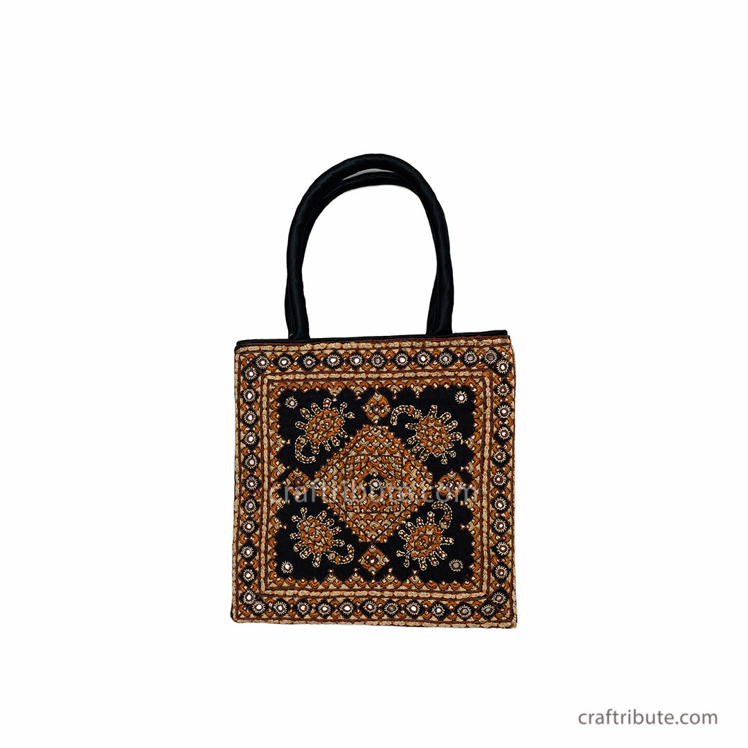 Front side of a classy handbag with Neran Kutch hand Embroidery having a Scorpio ((Vicchi) design in attractive Black & Orange combination