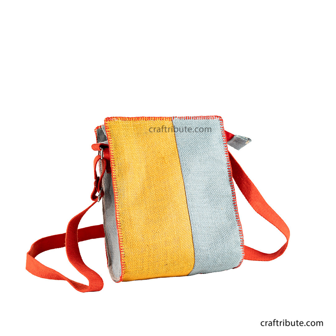Back side of hand embroidered Yellow & Grey jute sling bag with red belt