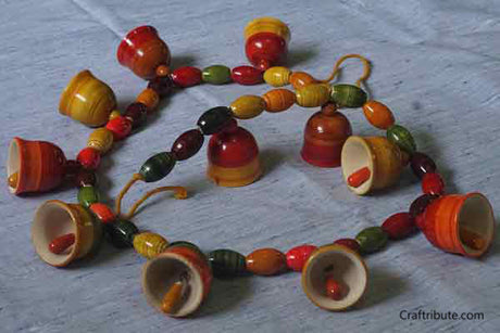 Lacquer finished handcrafted Wooden Toran with colourful beads and bells from Etikoppakka, Andhra Pradesh