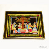 A scene depicting friends enjoying under a tree hand painted by Tikuli Artists from Bihar.
