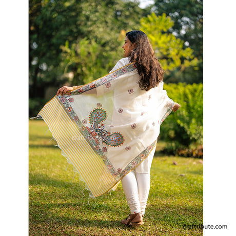 Back side of a beautiful piece of Madhubani cotton silk dupatta hand painted by skilled artisans from Bihar. Delicate pink colour with intricate triangles border and elegant peacocks in the  centre and attractive floral design